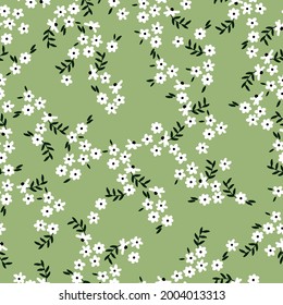 Resumen de patrones vintage sin inconvenientes. fondo verde. flores blancas pequeñas. hojas negras. textura vectorial. impresión de tendencia para textiles y papel pintado.