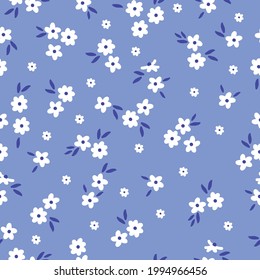 nahtlose Vintage Muster abstrakt. hellblauer Hintergrund. kleine weiße Blumen. dunkelblaue Blätter. Vektorstruktur. modischer Druck für Textilien und Tapeten.