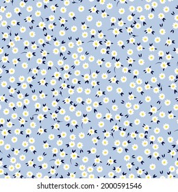Seamless vintage pattern abstract. light blue background. white small flowers. dark leaves. vector texture. trend print for textiles and wallpaper.