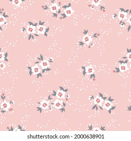 Seamless vintage pattern abstract. light pink background. white flowers. gray leaves. white dots. vector texture. fashionable print for textiles and wallpaper.