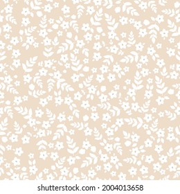 Seamless vintage pattern abstract. light beige background. small white flowers and leaves . vector texture. trend print for textiles and wallpaper.
