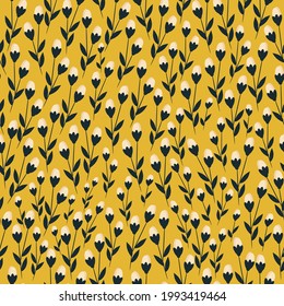 Seamless vintage pattern abstract. mustard background. light-colored flowers. black leaves. vector texture. trend print for textiles and wallpaper.