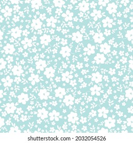 Resumen de patrones vintage sin inconvenientes. el adorno es de flores blancas y hojas sobre un fondo azul claro. textura vectorial. impresión de tendencia para textiles y papel pintado.