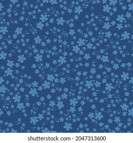 Resumen de patrones vintage sin inconvenientes. un adorno de flores azules y hojas sobre un fondo azul oscuro. textura vectorial. impresión de tendencia para textiles, papel pintado y embalaje.