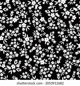 Seamless vintage pattern abstract. the ornament is white flowers and leaves on a black background. vector texture. trend print for textiles, wallpaper and packaging.