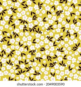 Seamless vintage pattern abstract. white flowers and black leaves on a yellow background. vector texture. trend print for textiles, wallpaper and packaging.