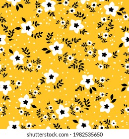 Seamless vintage pattern abstract. yellow background. white flowers and dots. black leaves. vector texture. trend print for textiles and wallpaper.