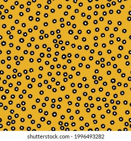 nahtlose Vintage Muster abstrakt. gelber Hintergrund. kleine schwarze Blumen. Vektorstruktur. Trenddruck für Textilien und Tapeten.