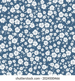Seamless vintage pattern. Beautiful ornament of white flowers and leaves on a blue background. Vector texture . Trend print for textiles and wallpaper.