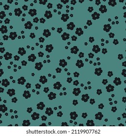 Seamless vintage pattern. Black flowers. Green background. vector texture. fashionable print for textiles, wallpaper and packaging.