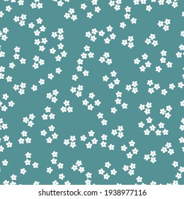 Seamless vintage pattern. blue background. small white flowers. vector texture. elegant print for textiles and wallpaper.
