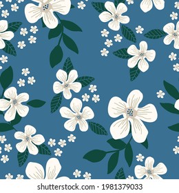 Seamless vintage pattern. Blue background. large and small white flowers. green leaves. vector texture. fashionable print for textiles and wallpaper.