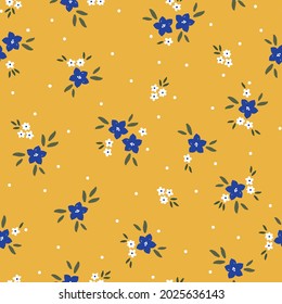 Patrón vintage sin foco. flores azules y blancas, hojas verdes. puntos blancos sobre un fondo amarillo. textura vectorial. impresión de tendencia para textiles y papel pintado.