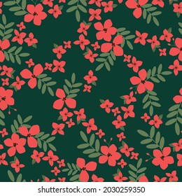 Patrón vintage sin foco. flores rojas brillantes y hojas verdes sobre un fondo verde oscuro. textura vectorial. impresión de tendencia para textiles.