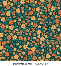Patrón vintage sin foco. flores naranjas y amarillas lindas, hojas verdes sobre un fondo verde oscuro. textura vectorial. una imprenta de moda para textiles y papel pintado.