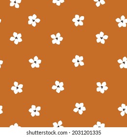 Seamless vintage pattern. cute white flowers on a terracotta background. vector texture. trend print for textiles and wallpaper.