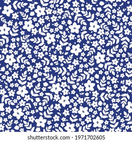 seamless vintage pattern. dark blue background. white flowers and leaves. vector texture. fashionable print for textiles, wallpaper and packaging.