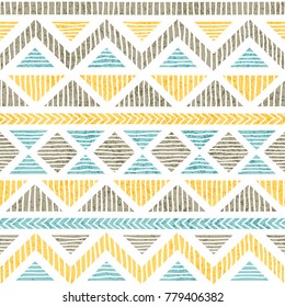 Seamless vintage pattern. Ethnic and tribal motifs. Grunge texture. Gray, blue and yellow geometric elements on a white background. Prints for textiles. Vector illustration.