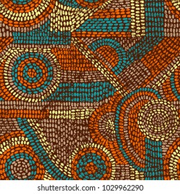 Seamless vintage pattern. Grunge texture. Print in the style of patchwork. Handmade. Yellow, blue, orange and red colors. Vector illustration.