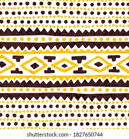 Seamless vintage pattern. Grunge texture. Ethnic and tribal motifs. Yellow, brown and white colors. Vector illustration.