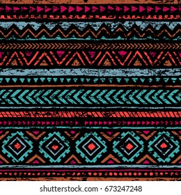 Padrão vintage sem costura. Textura grunge. Motivos étnicos e tribais. Cores azul, laranja, vermelho, preto e rosa. Ilustração vetorial.