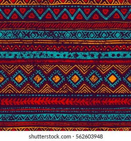 Seamless vintage pattern. Grungy texture. Ethnic and tribal motifs. Blue, orange, red and purple colors. Vector illustration.