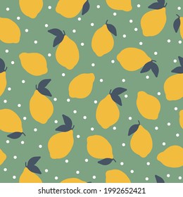 Seamless vintage pattern of lemons. green background. juicy lemons. white dots. fashionable print for textiles and wallpaper.