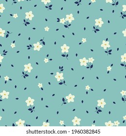 seamless vintage pattern. light blue background. white flowers. blue leaves. vector texture. fashionable print for textiles and wallpaper.