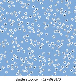 seamless vintage pattern . light blue background. small white flowers. vector texture. fashionable print for textiles and wallpaper.
