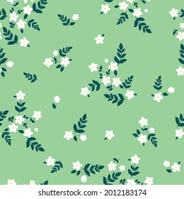 seamless vintage pattern. light green background. white flowers. dark green leaves. vector texture. fashionable print for textiles and wallpaper.