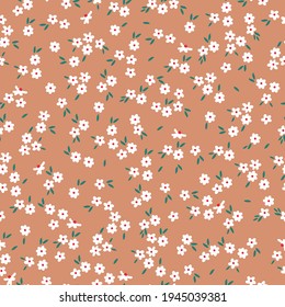 seamless vintage pattern. light teracotta background. small white flowerspi.flowers. vector texture. trend print for textiles and wallpaper.
