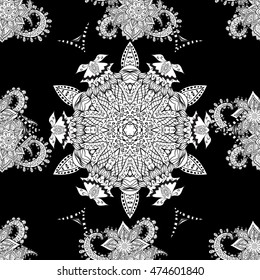 Seamless vintage pattern on black background with white and golden floral elements.