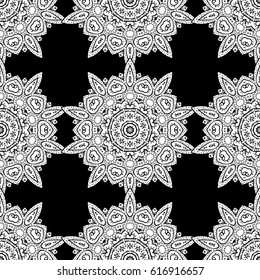 Seamless vintage pattern on black background with whiteen elements. Christmas, snowflake, new year. White seamless pattern on black background with white elements.