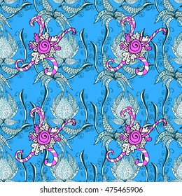 Seamless vintage pattern on blue background with floral elements.