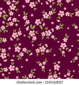 Seamless vintage pattern. Pink flowers, green leaves. Burgundy background. vector texture. fashionable print for textiles, wallpaper and packaging.