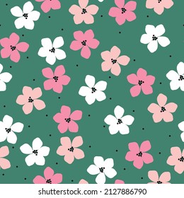 Seamless vintage pattern. Pink and white flowers, black dots. Green background. vector texture. fashionable print for textiles, wallpaper and packaging.