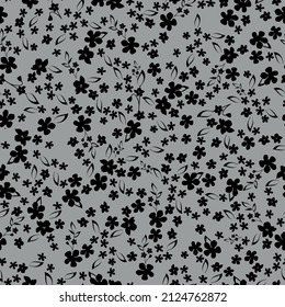 Seamless vintage pattern. Small black flowers and leaves . Gray background. vector texture. fashionable print for textiles, wallpaper and packaging.