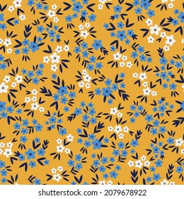 Patrón vintage sin foco. flores pequeñas azules y blancas, hojas de color azul oscuro sobre un fondo amarillo. textura vectorial. impresión de moda para textiles.