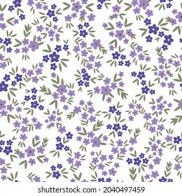 Seamless vintage pattern. small lilac and purple flowers, green leaves. vector texture. trend print for textiles and wallpaper.