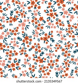 Seamless vintage pattern. Small orange flowers, blue leaves. White background. vector texture. fashionable print for textiles, wallpaper and packaging.