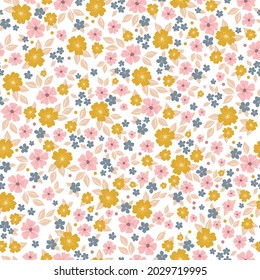 Seamless vintage pattern . small pink, blue and yellow flowers on a white background. vector texture. a trend template for fashionable prints.