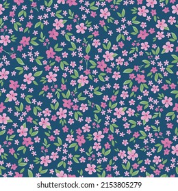 Seamless vintage pattern. Small pink flowers, light green leaves. Blue background. vector texture. fashionable print for textiles, wallpaper and packaging.