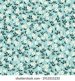 seamless vintage pattern. small white flowers, pale blue background. Vector texture. Fashionable print for textiles, wallpaper.