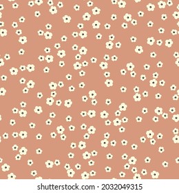 Patrón vintage sin foco. flores blancas en un fondo de terracota claro. textura vectorial. impresión de tendencia para textiles y papel pintado.
