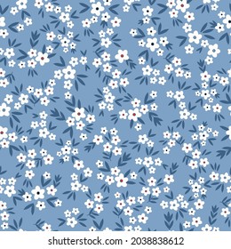 Seamless vintage pattern. small white flowers, blue leaves. light blue background. vector texture. trend print for textiles. 