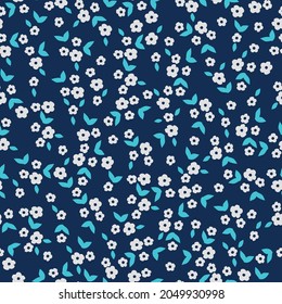 Seamless vintage pattern. small white flowers, bright blue leaves. dark blue background. vector texture. trend print for textiles and wallpaper.