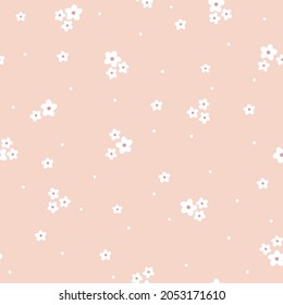 Seamless vintage pattern. small white flowers on a light pink background. vector texture. trend print for textiles and wallpaper.