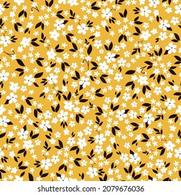 Seamless vintage pattern. small white flowers, black leaves on a yellow background. vector texture. fashionable print for textiles.