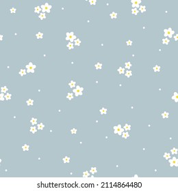 Seamless vintage pattern. Small white flowers and leaves, dots. Light blue background. vector texture. fashionable print for textiles, wallpaper and packaging.