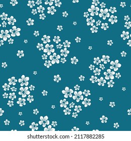 Seamless vintage pattern. Small white flowers . Blue background. vector texture. fashionable print for textiles, wallpaper and packaging.